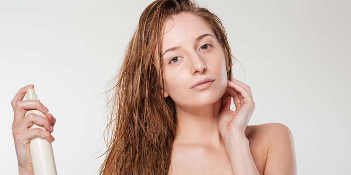 young-woman-spraying-hairspray-SBI-300966495-min-scaled.jpg